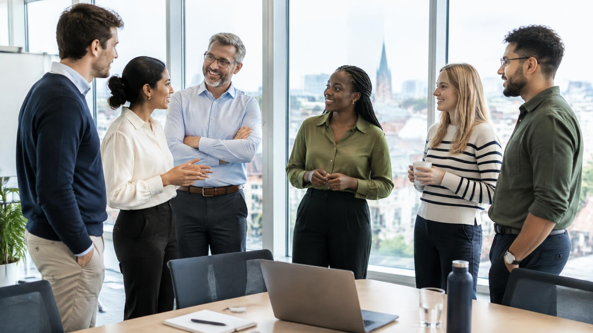 Group of colleagues having a conversation in a conference room